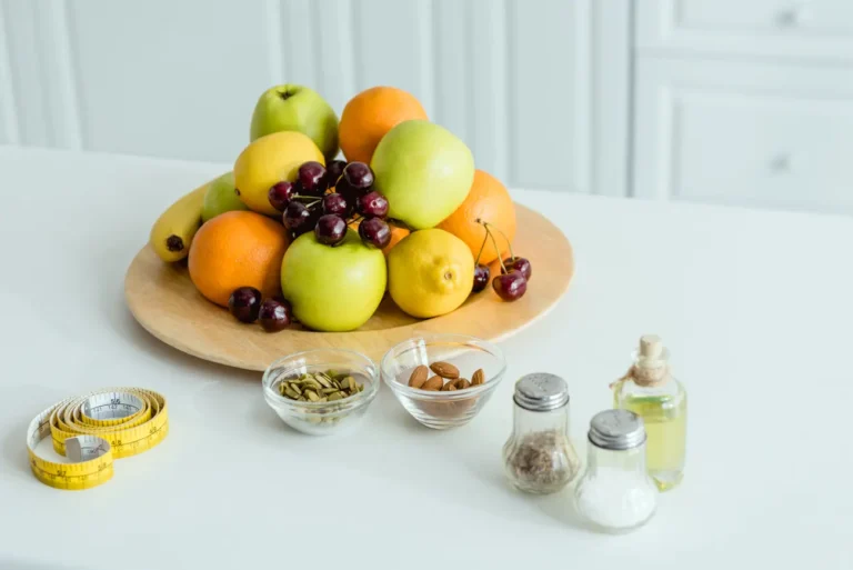 tasty and ripe fruits on plate near measuring tape 2023 11 27 04 52 45 utc